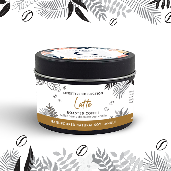 Handpoured 'Latte' Roasted Coffee fragranced soy wax 165gm travel candle in a black tin with decorative white label, made by Coorong Candle Co in South Australia, inspired by the Coorong. Image has decorative illustration at the top and bottom to match the travel candle label.